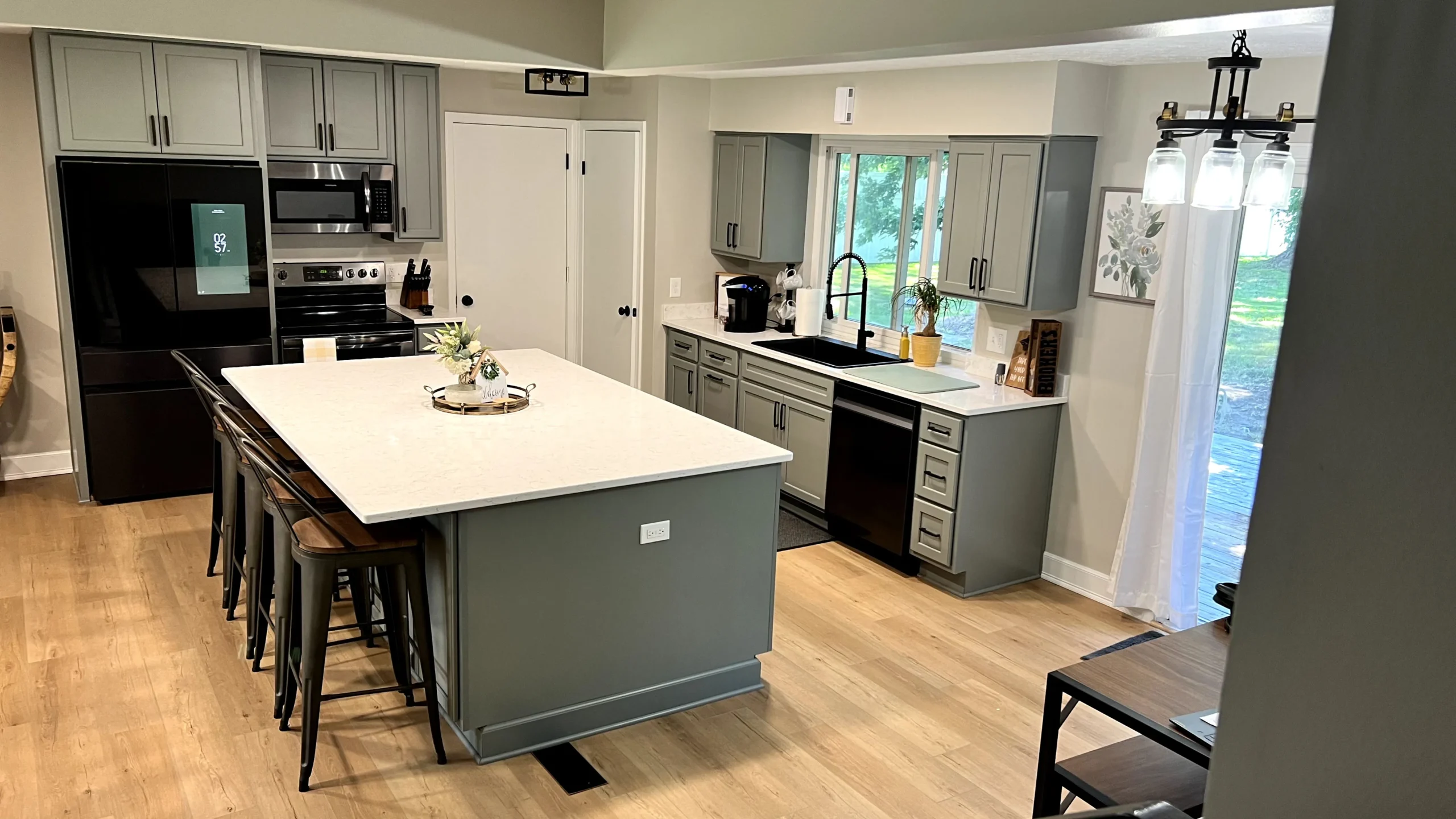 Kitchen cabinets repainted by Four Seasons Paint Co.