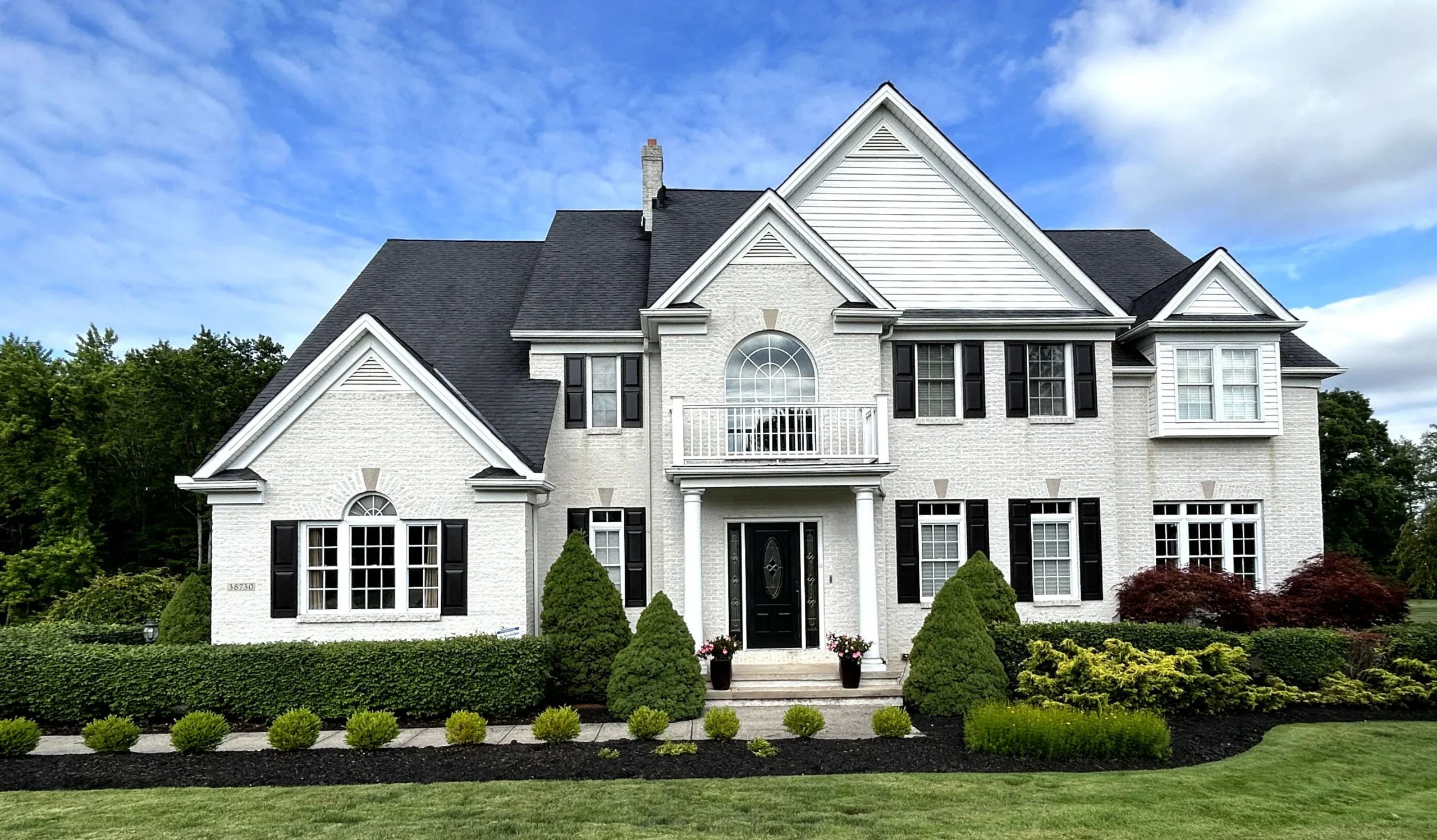 Two-story home exterior repainted by Four Seasons Paint Co. in Lake County, Ohio