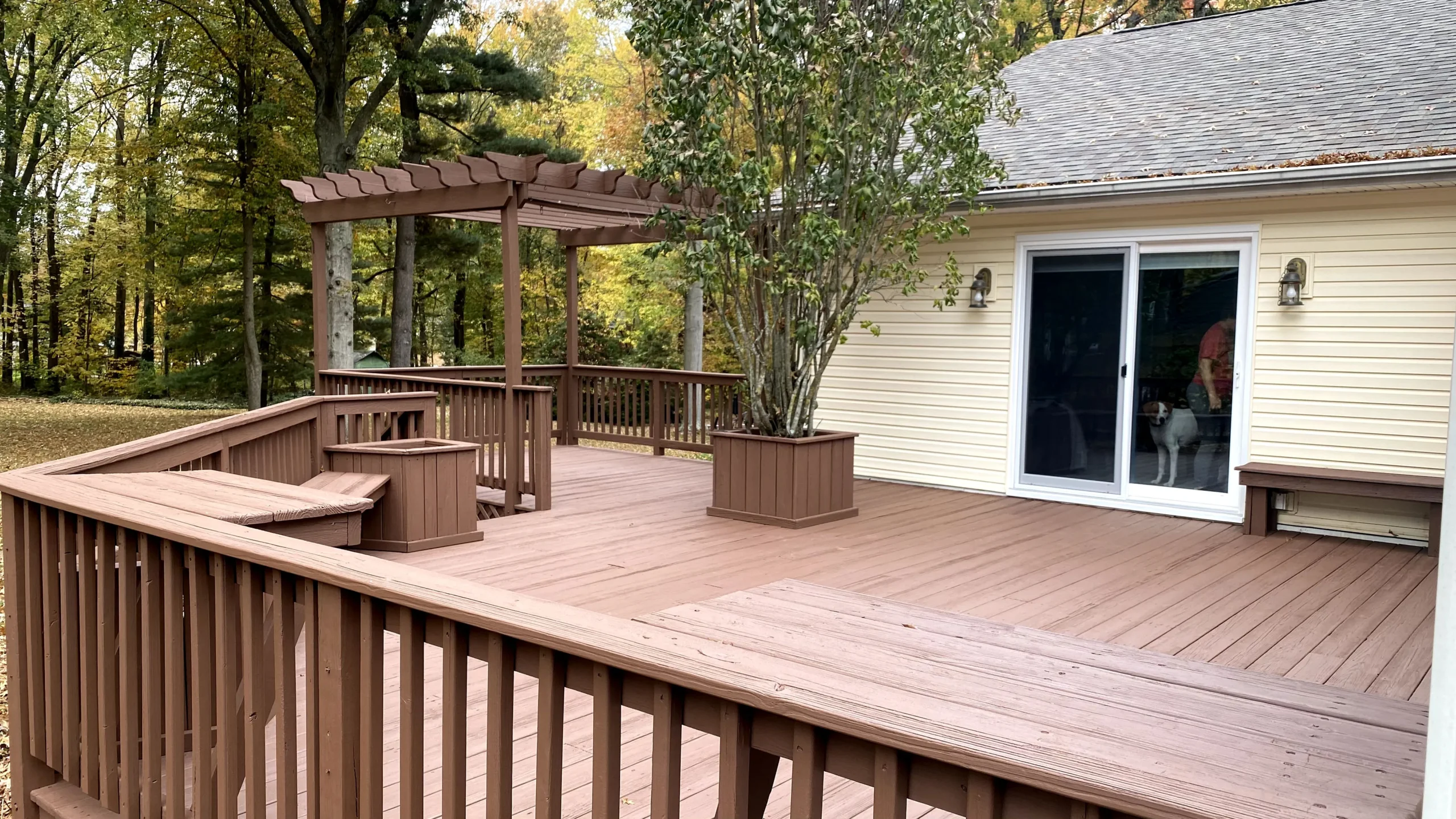 Stained deck and pergola completed by Four Seasons Paint Co.