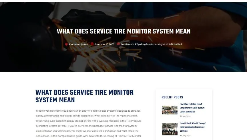 The What Does Service Tire Monitor System Mean article on Town Center Automotive with a dark hero photo of a mechanic at work